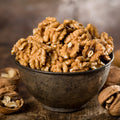 NUECES LIGERAS MITADES Y TROZOS TRATADAS (PASCULO) 25# (A GRANEL)